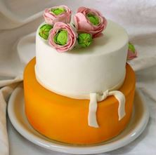 Picture of Yellow & white cake with flowers